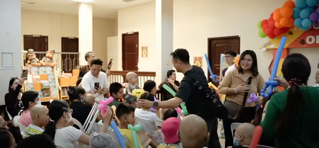 GCI members visiting cancer patients at House of Hope — balloon animals, smiles, and community support for children battling cancer