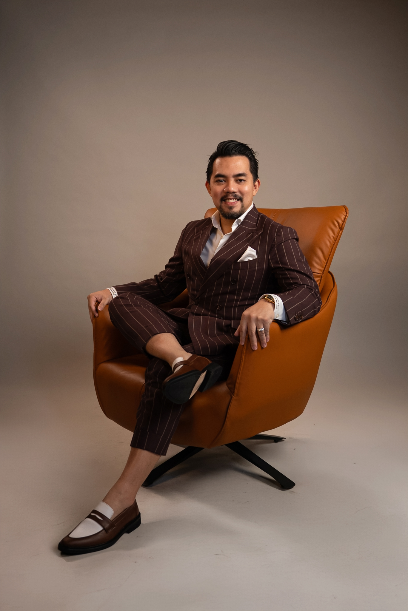 Reymond &lsquo;Boss RDR&rsquo; Delos Reyes, Founder and CEO of RDR Business Solutions Inc., in a studio portrait